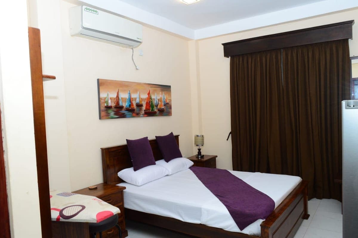 Abi Karai Villa — bedroom open to coastal air
